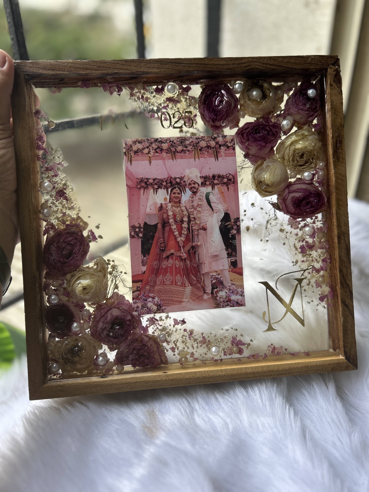 A wedding keepsake in a teakwood frame from MAD’s resin art catalogue